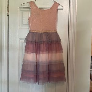 Beautiful dress.  Small makeup stain that can barely be seen. Seldom worn.